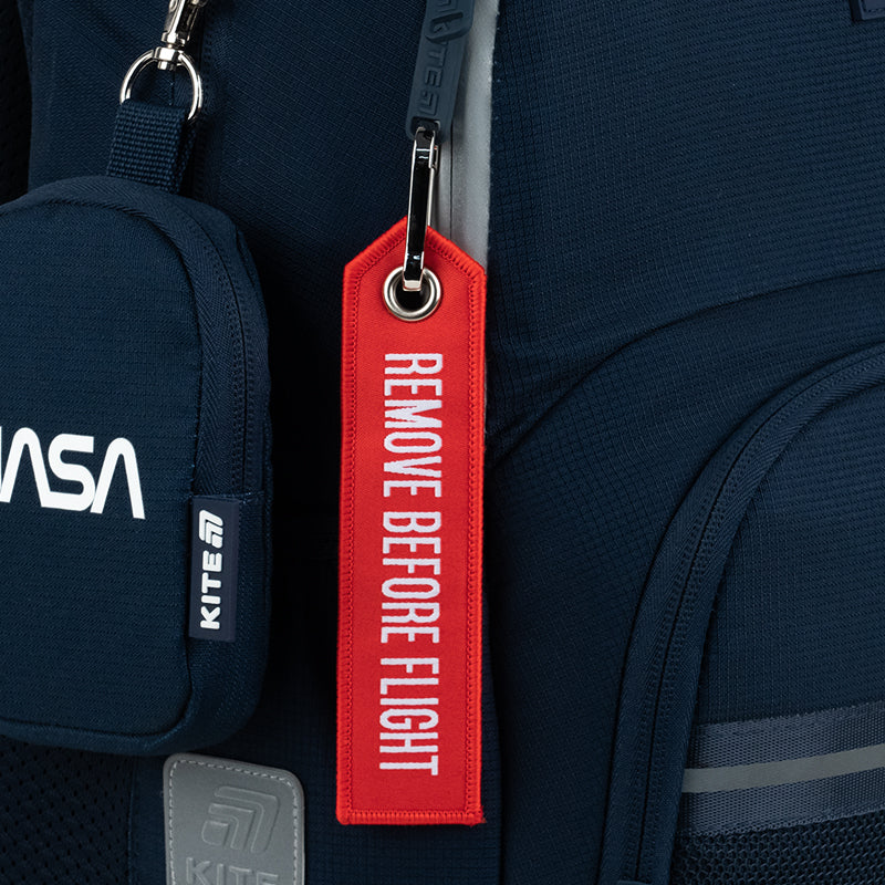 Stylowy plecak Kite NASA w kolorze niebieskim, z gumowymi ściągaczami i odblaskowymi detalami.