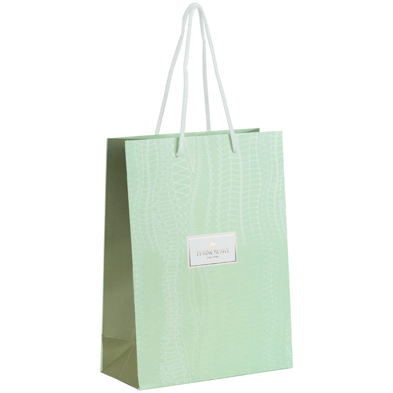 Widok z boku zielonej papierowej torby prezentowej Axent.