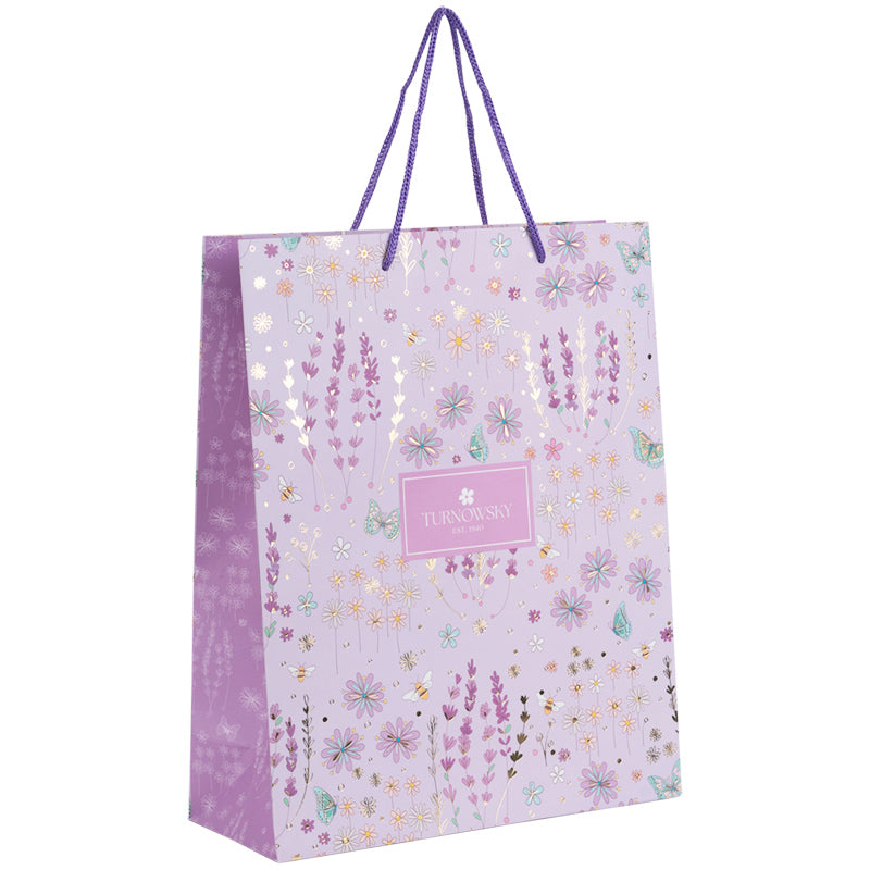 Widok z boku papierowej torby prezentowej Axent.