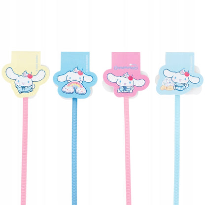 Detale ozdobnego opakowania z pastelowymi artykułami do segregowania notatek.