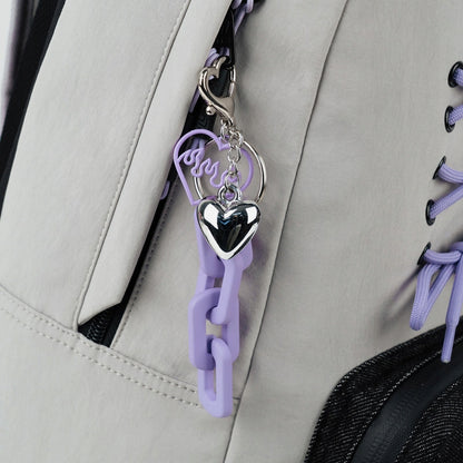 Brelok-zawieszka z łączonych materiałów przy plecaku Kite